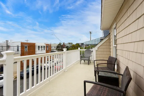 a view of balcony with furniture
