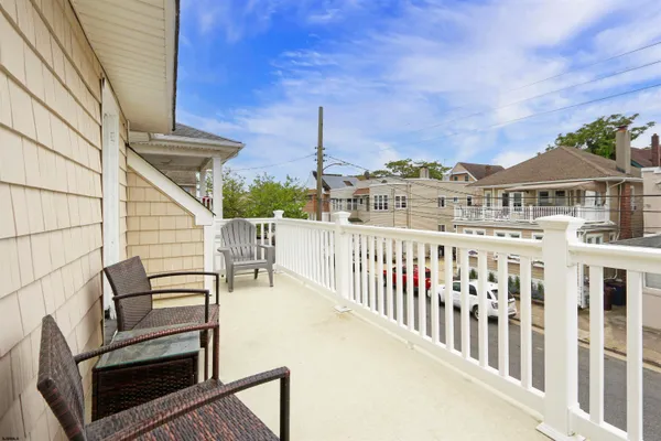 a view of a balcony with chairs