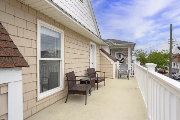 a view of a patio with a table and chairs