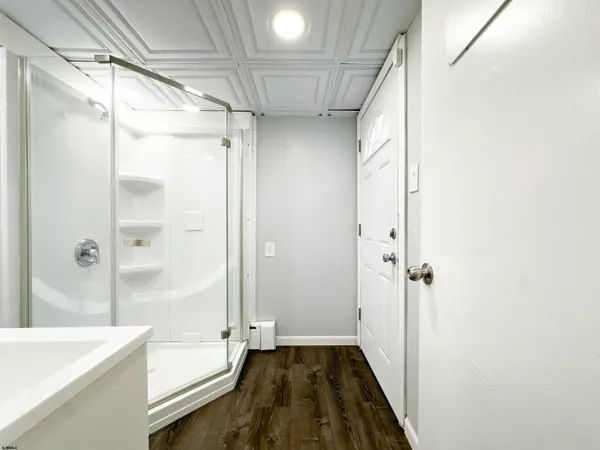 a bathroom with a bathtub and a shower