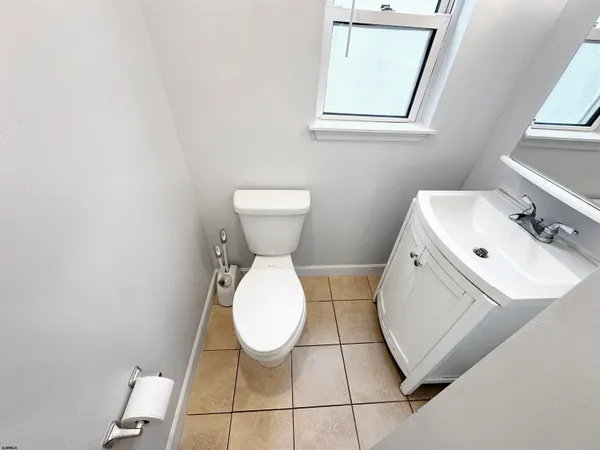 a bathroom with a sink toilet and vanity