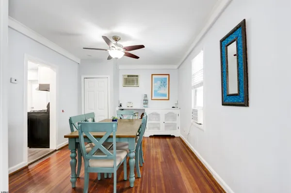 a view of a livingroom with furniture and a window