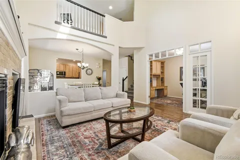 a living room with furniture and a table