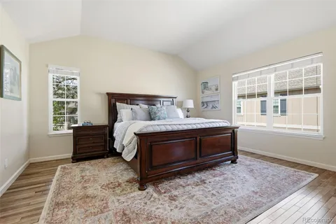 a bed sitting in a bedroom next to a window