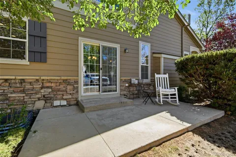 a view of a two chairs in the patio
