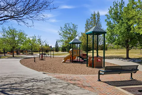 a view of a park with swings and slides