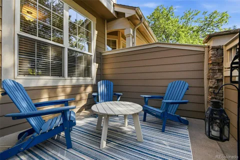 a view of a chairs and table in the balcony