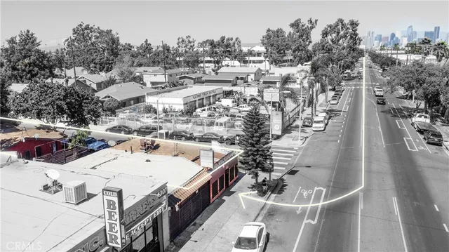 an aerial view of a residential building with parking space