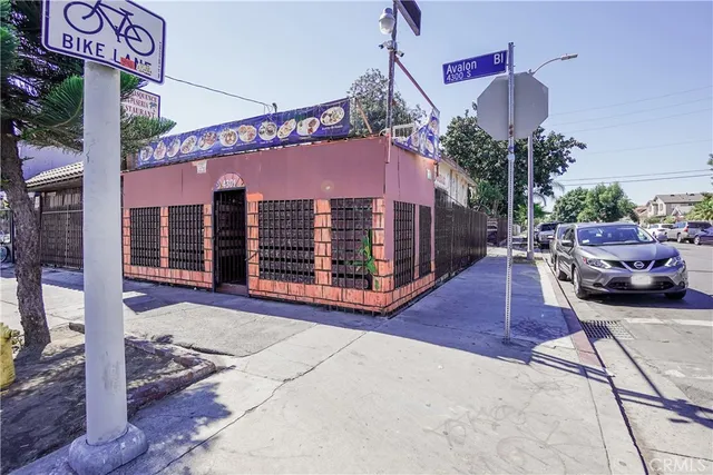 a view of a street with sitting area