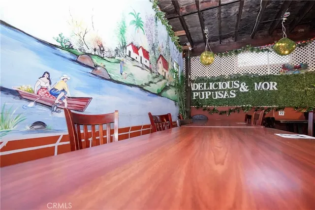 a view of a chairs and table in a patio