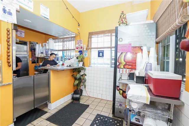 a front view of a house with patio furniture