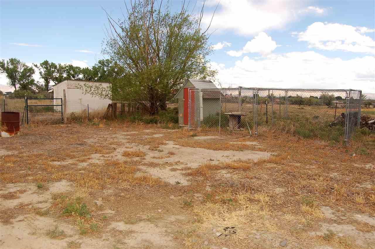 2204 H Road Grand Junction, CO 81505 - Photo 13 of 21 a backyard of a house with table and chairs