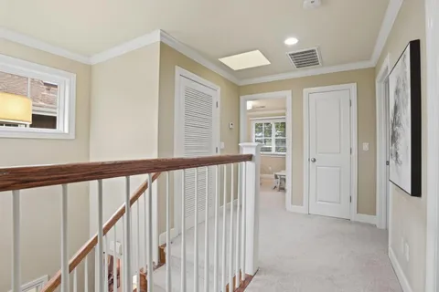 a view of an entryway with wooden floor