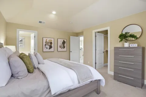 a bedroom with a bed and closet