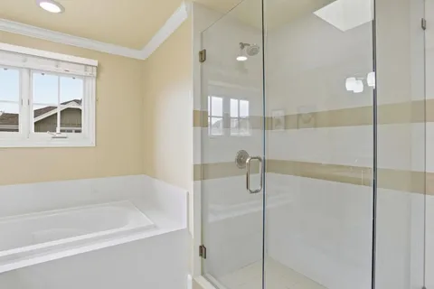 a bathroom with a bathtub and a shower