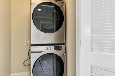 a view of a patio with a table and chairs