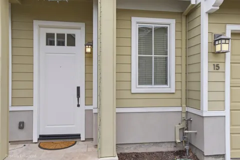 a front view of a house with white door