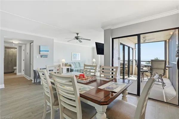 a view of a dining room with furniture window and wooden floor