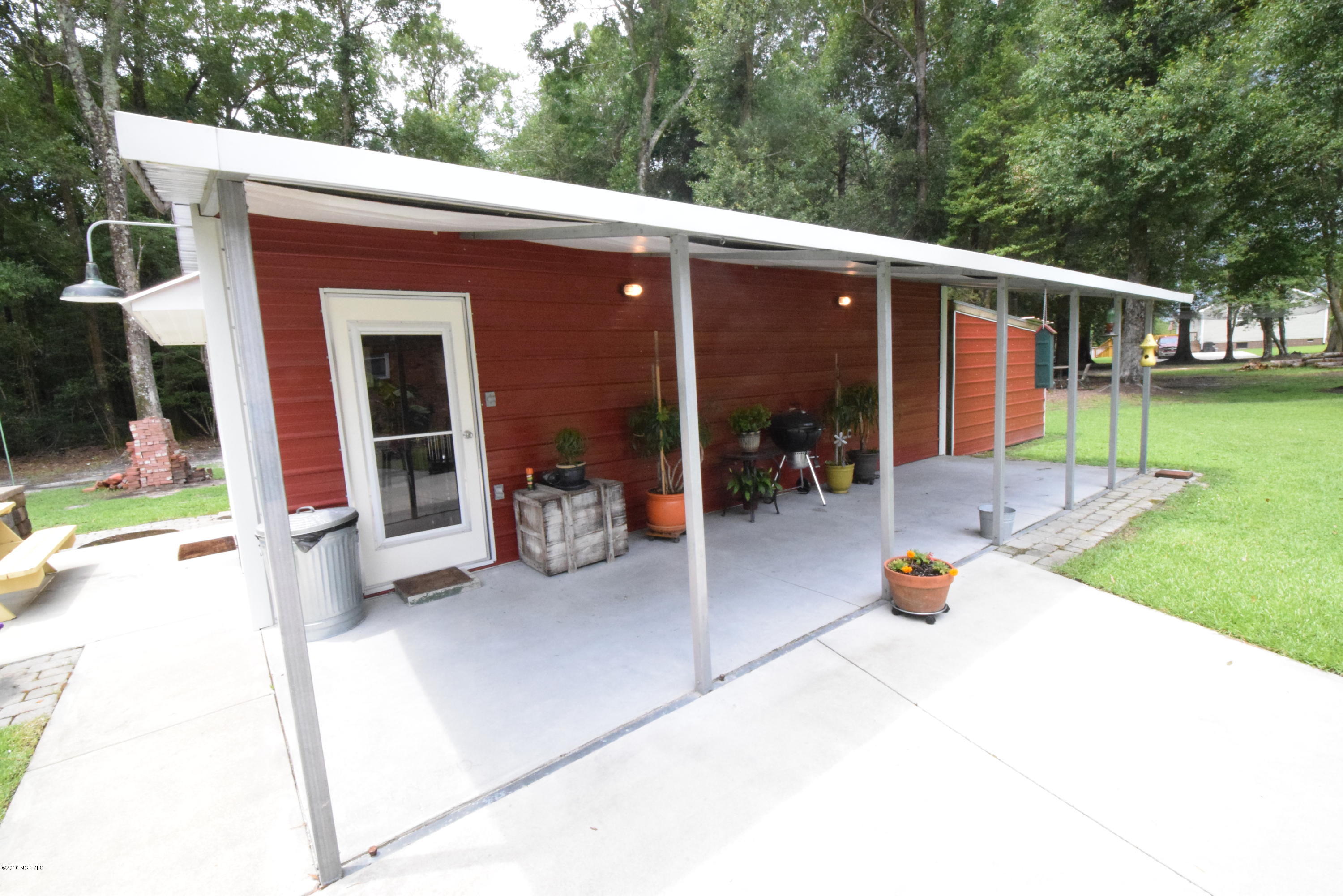 135 Virgin Road Newport, NC 28570 - Photo 38 of 39 Mancave Front Cover Porch