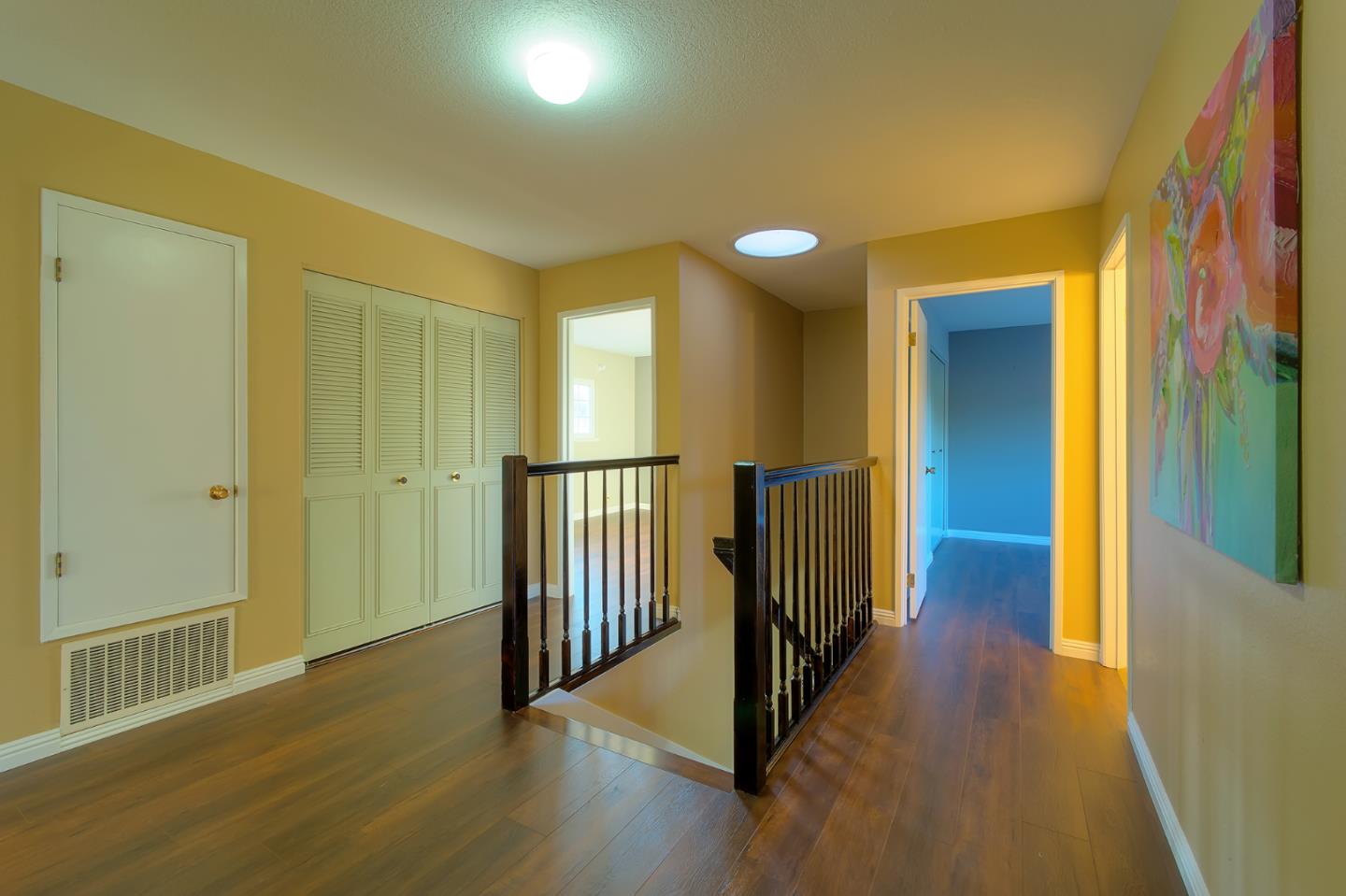 664 New Compton Drive San Jose, CA 95136 - Photo 11 of 26 a view of a hallway with wooden floor and closet