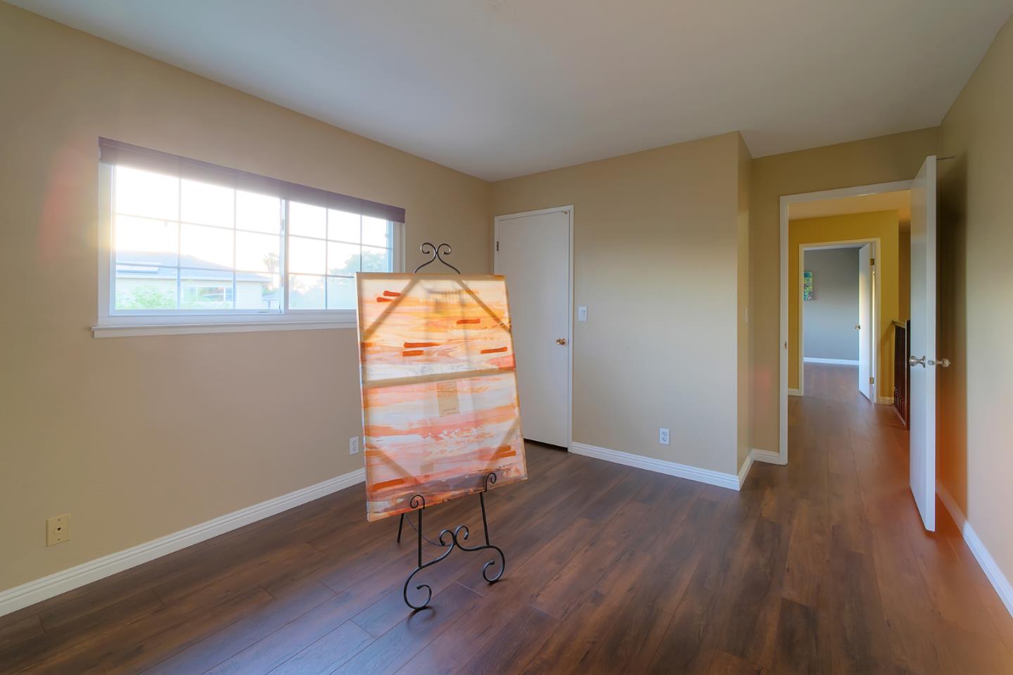 664 New Compton Drive San Jose, CA 95136 - Photo 19 of 26 a view of a livingroom with wooden floor and a window