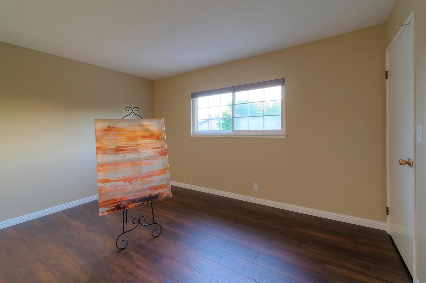 664 New Compton Drive San Jose, CA 95136 - Photo 20 of 26 a room with a wooden floor and a window
