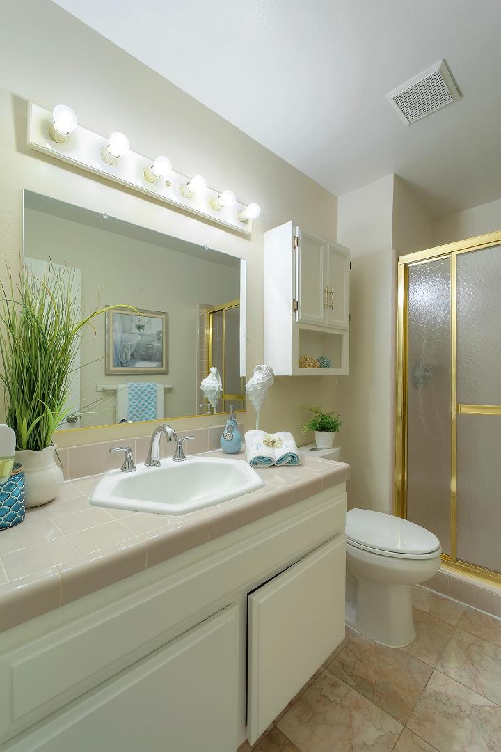 664 New Compton Drive San Jose, CA 95136 - Photo 4 of 26 a bathroom with a sink a toilet and a mirror