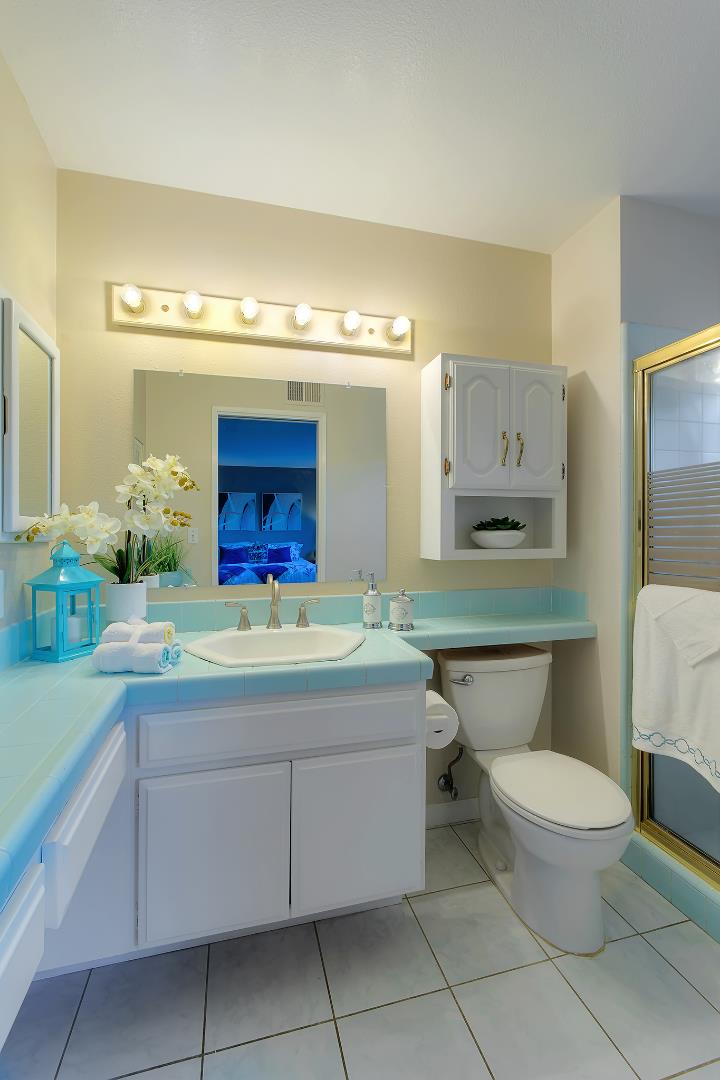 664 New Compton Drive San Jose, CA 95136 - Photo 7 of 26 a bathroom with a toilet sink and mirror