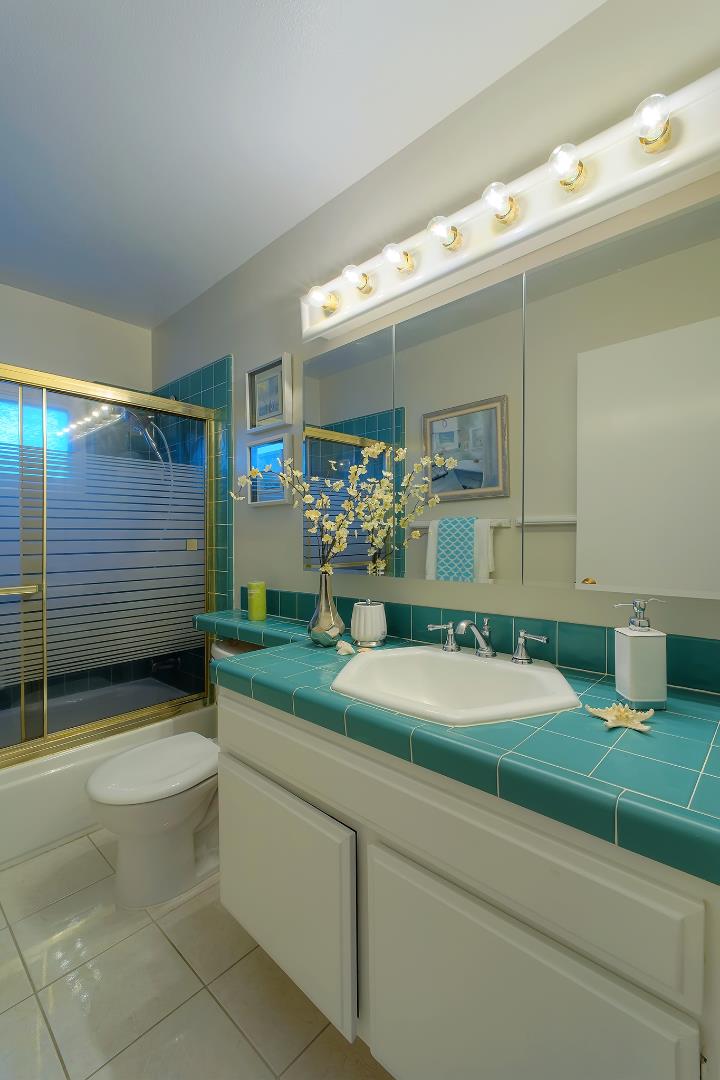 664 New Compton Drive San Jose, CA 95136 - Photo 9 of 26 a bathroom with a sink and a mirror