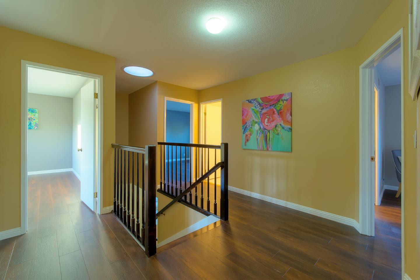 664 New Compton Drive San Jose, CA 95136 - Photo 10 of 26 a view of a hallway with wooden floor and windows