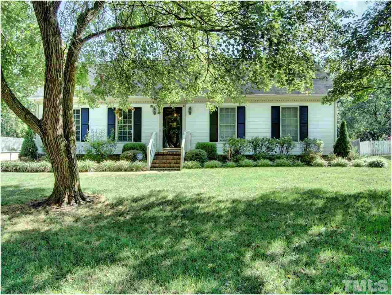 2016 Travianna Court Raleigh, NC 27609 - Photo 1 of 19 a front view of house with yard and green space