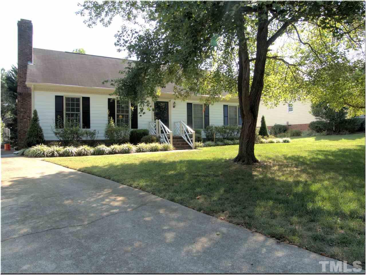 2016 Travianna Court Raleigh, NC 27609 - Photo 2 of 19 a view of a house with backyard and a tree