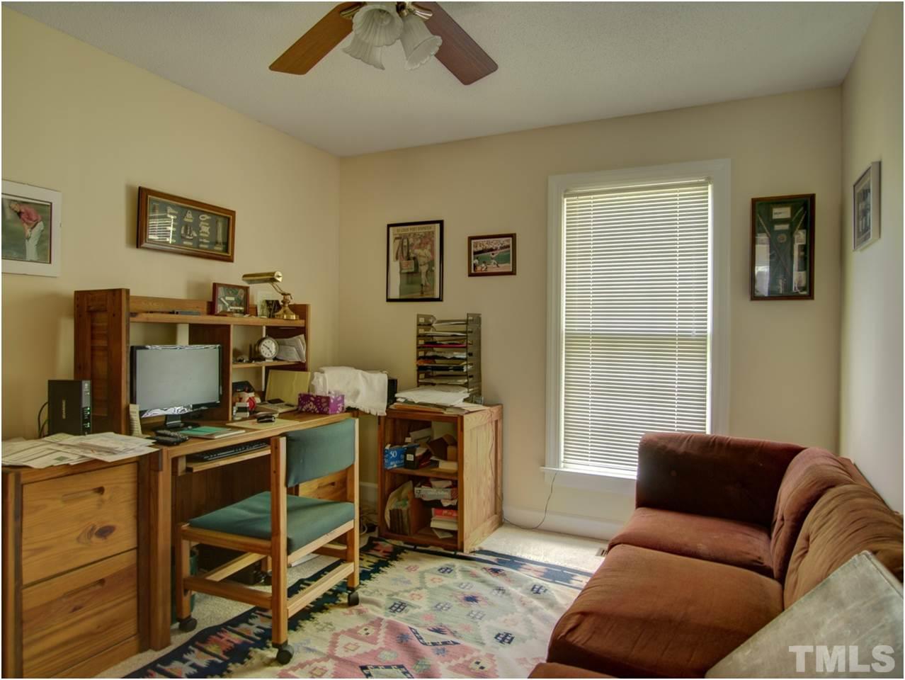 2016 Travianna Court Raleigh, NC 27609 - Photo 14 of 19 a livingroom with workspace and a window