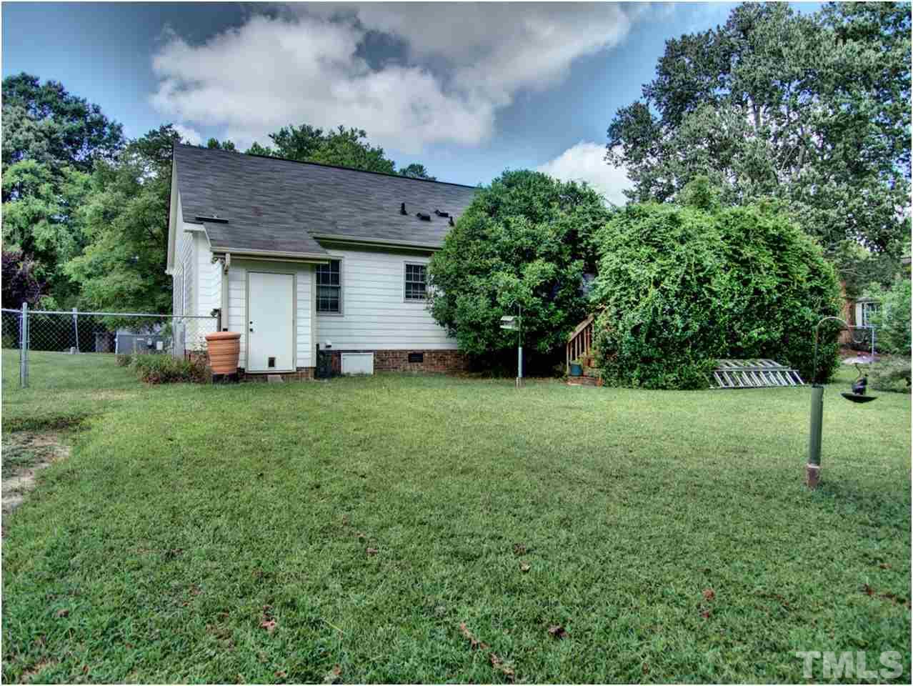 2016 Travianna Court Raleigh, NC 27609 - Photo 17 of 19 a view of a house with a yard