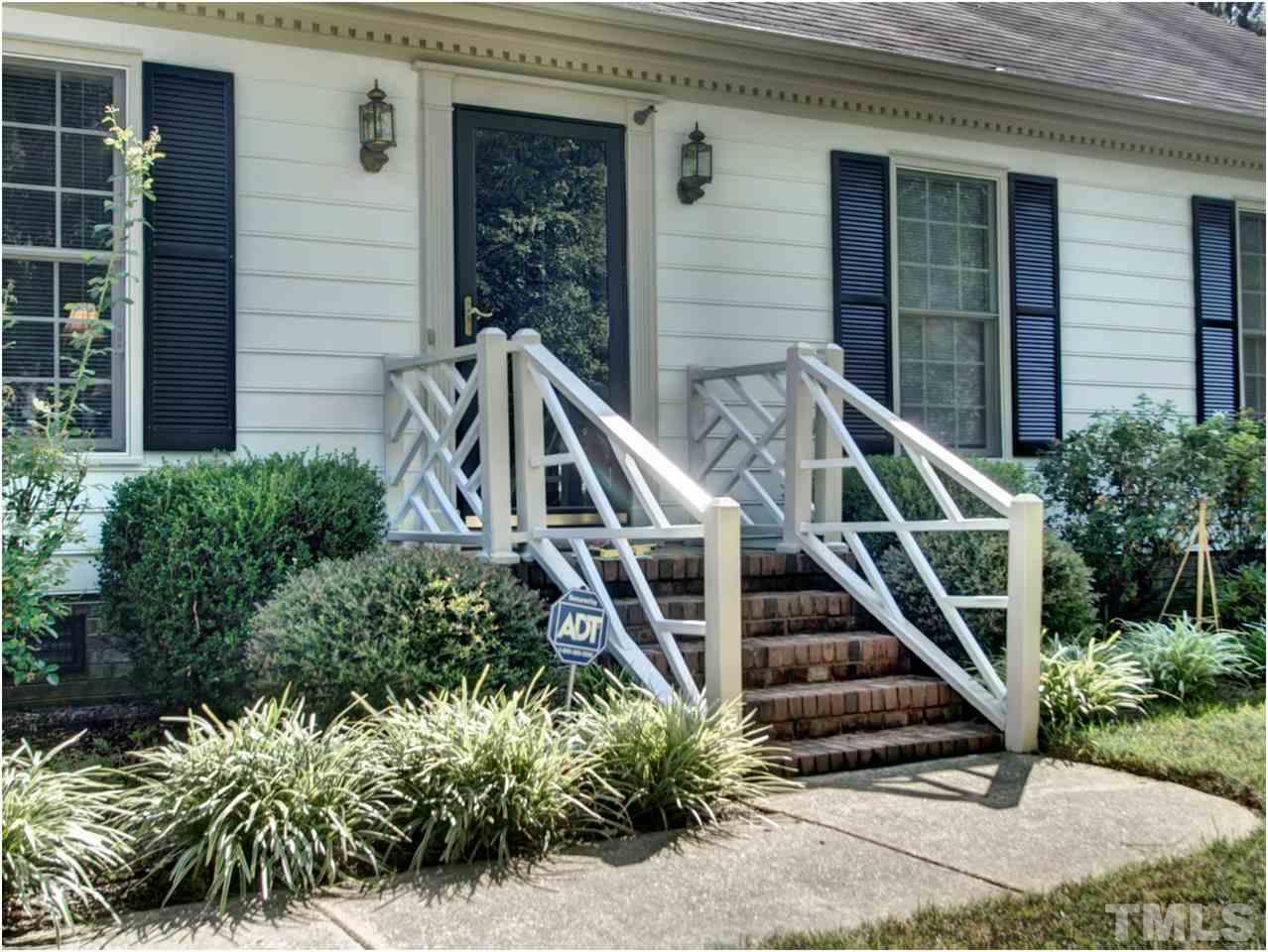 2016 Travianna Court Raleigh, NC 27609 - Photo 3 of 19 a front view of a house with wooden stairs