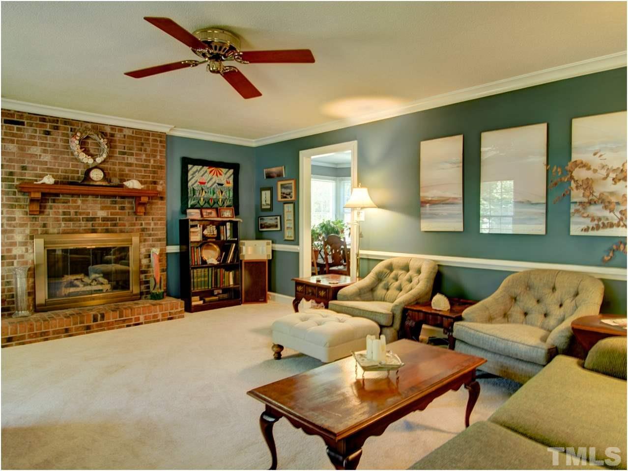 2016 Travianna Court Raleigh, NC 27609 - Photo 4 of 19 a living room with furniture and a fireplace
