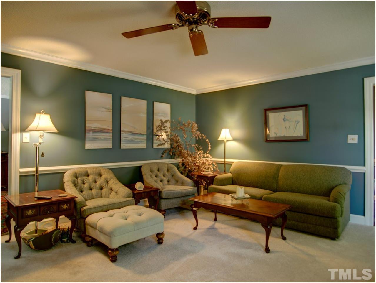 2016 Travianna Court Raleigh, NC 27609 - Photo 6 of 19 a living room with furniture and a lamp