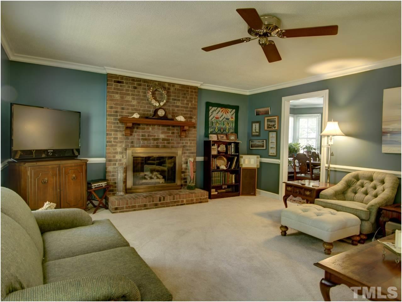 2016 Travianna Court Raleigh, NC 27609 - Photo 7 of 19 a living room with furniture and a flat screen tv