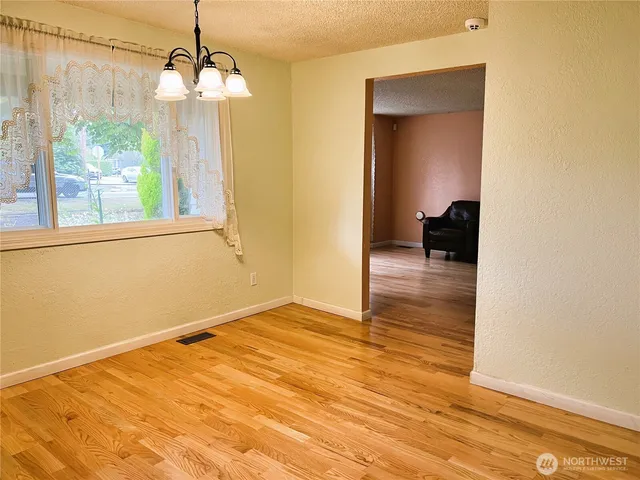 a view of livingroom with hardwood floor and a ceiling fan