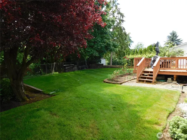 a view of a house with a backyard porch and sitting area