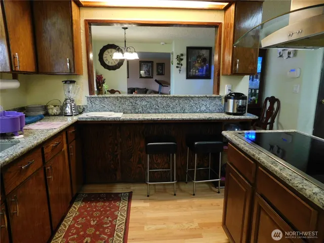 a kitchen with a sink and a stove top oven
