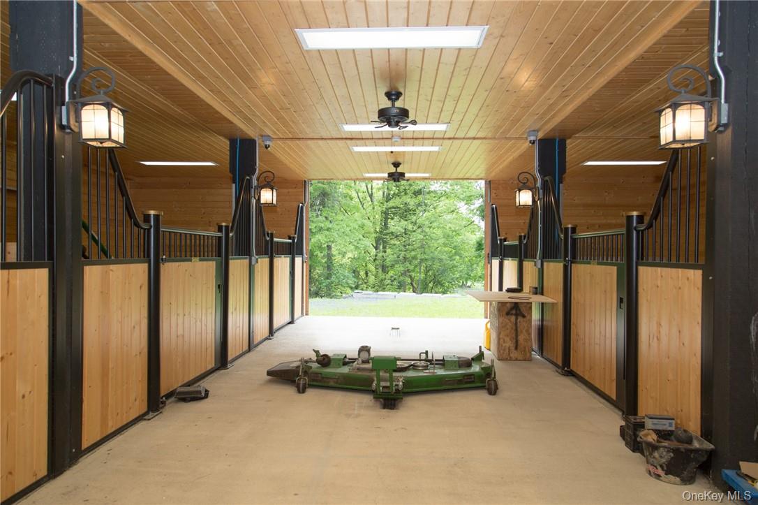 101 Mountain Lodge Road Washingtonville, NY 10992 - Photo 25 of 26 a bed room with a bed and a chandelier