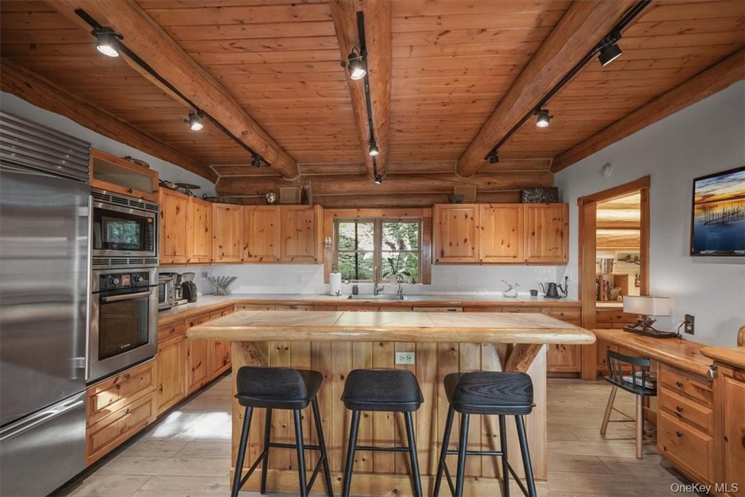 101 Mountain Lodge Road Washingtonville, NY 10992 - Photo 8 of 26 a large kitchen with a table and chairs
