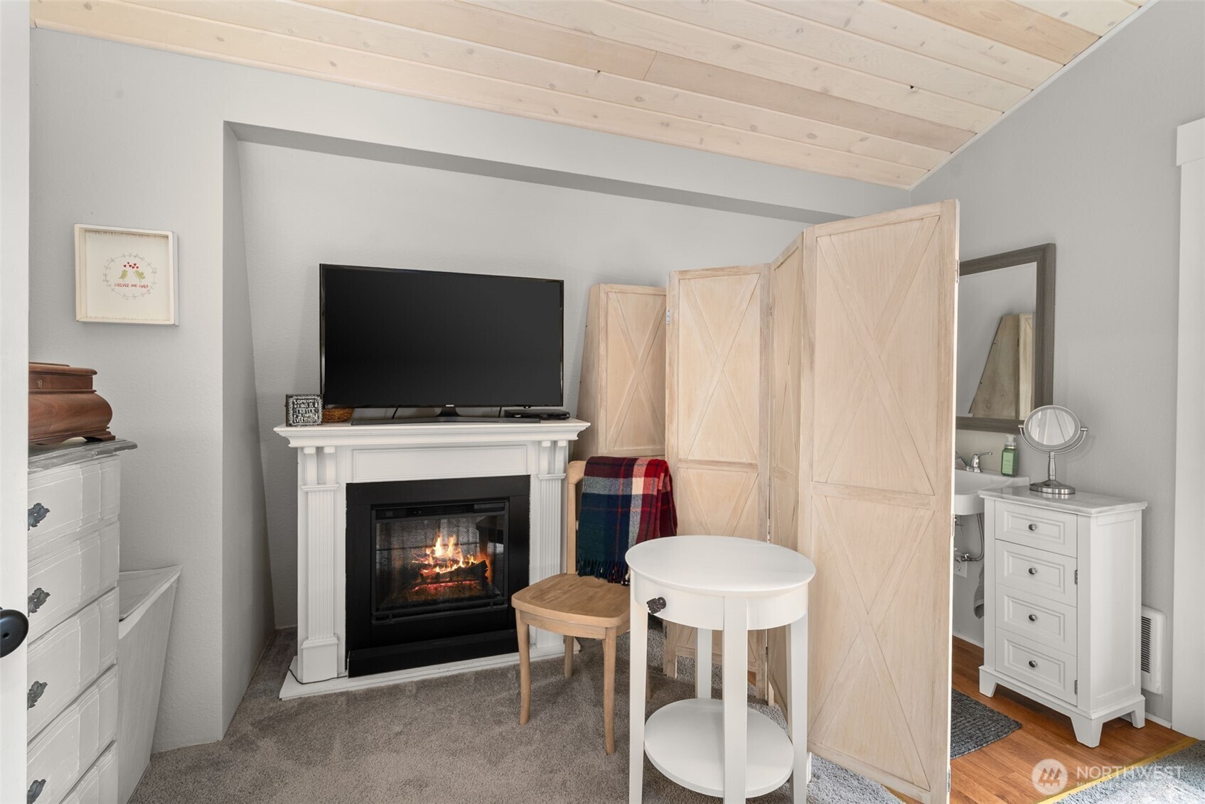 2800 East Phillips Lake Loop Road Shelton, WA 98584 - Photo 14 of 40 a living room with furniture a fireplace and a flat screen tv
