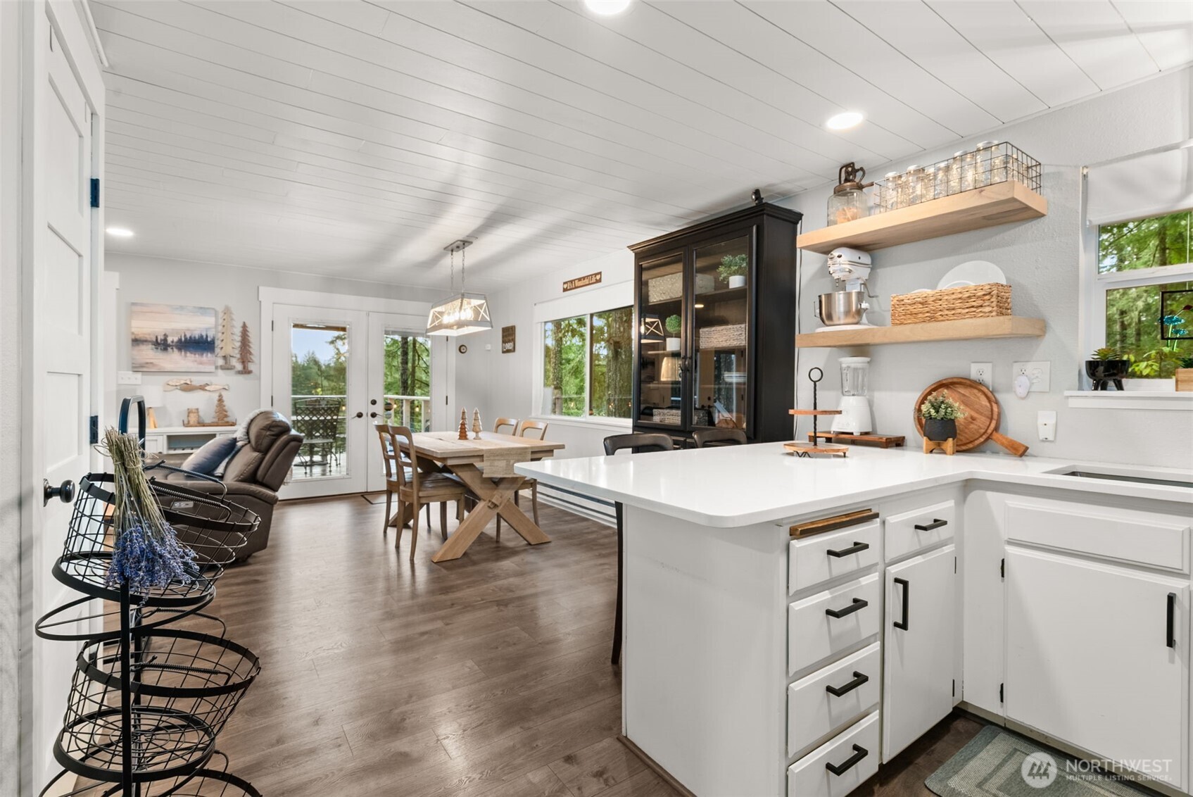 2800 East Phillips Lake Loop Road Shelton, WA 98584 - Photo 4 of 40 an open kitchen with a table and chairs