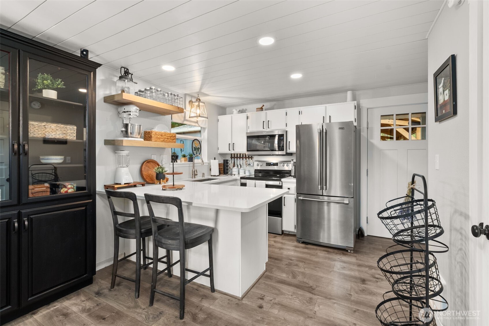2800 East Phillips Lake Loop Road Shelton, WA 98584 - Photo 7 of 40 a kitchen with a refrigerator a stove a sink and a workspace