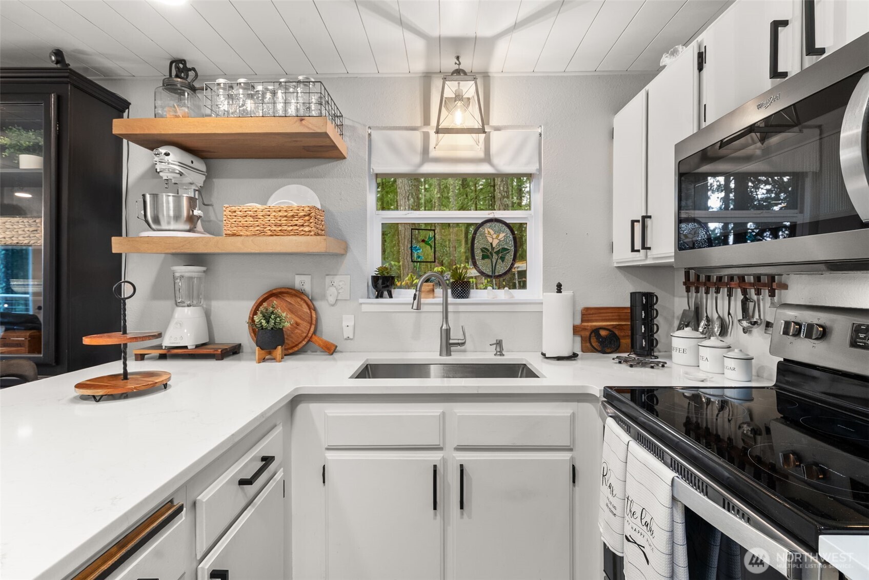 2800 East Phillips Lake Loop Road Shelton, WA 98584 - Photo 8 of 40 a kitchen with a sink a stove and cabinets