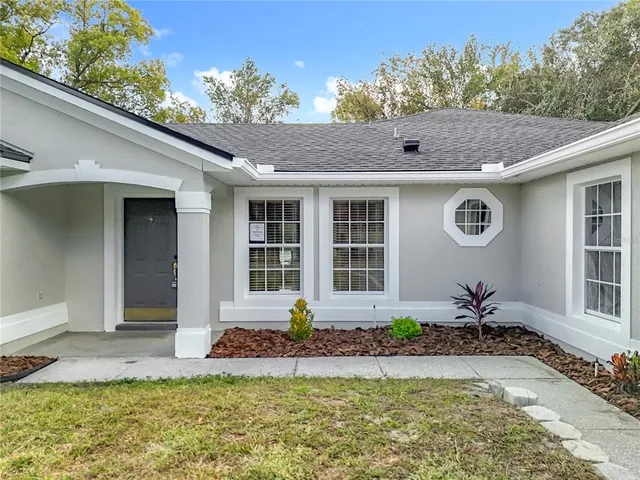 a view of a livingroom with furniture and windows