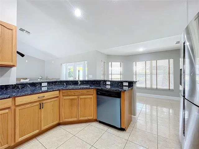 a view of a livingroom with a ceiling fan and window