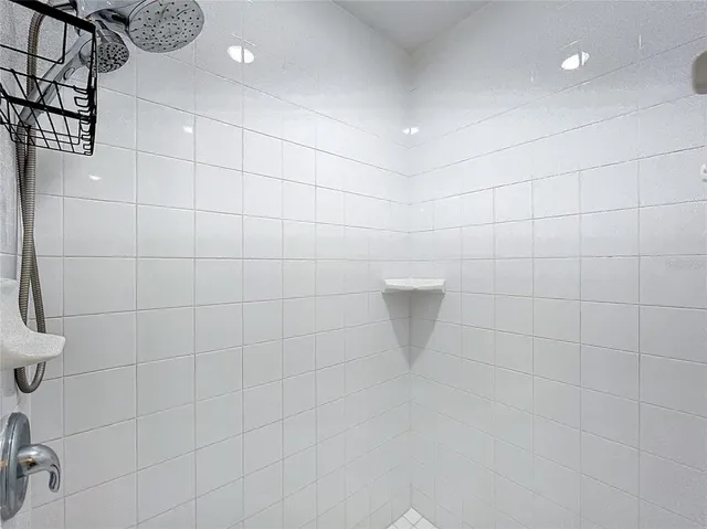 a bathroom with a granite countertop sink a toilet and a bathtub